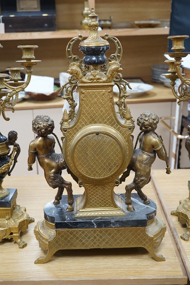A bronze and marble three piece garniture, key, no pendulum, 69cm. Condition - good, not tested as working